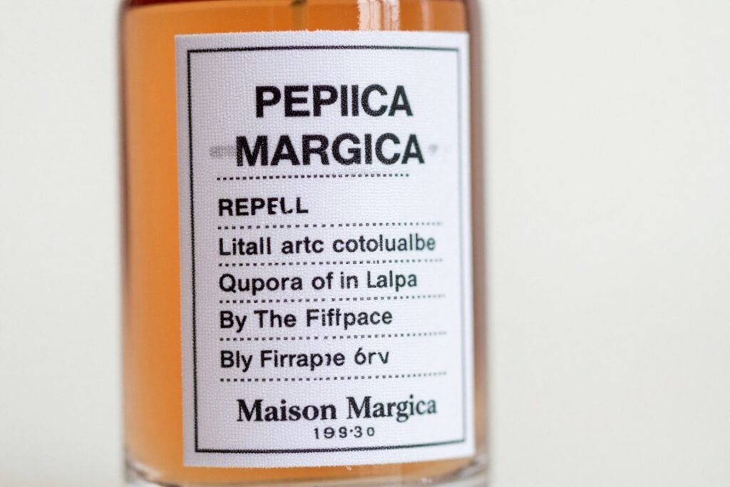 Maison Margiela Replica By The Fireplace perfume bottle close-up showing label details Maison Margiela Replica By The Fireplace perfume bottle close-up showing label details